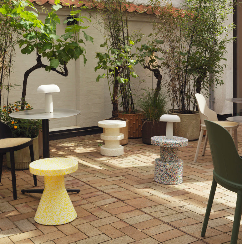 Three Bit Stools in White Multicolor, made of recycled material by Normann Copenhagen, in different styles.