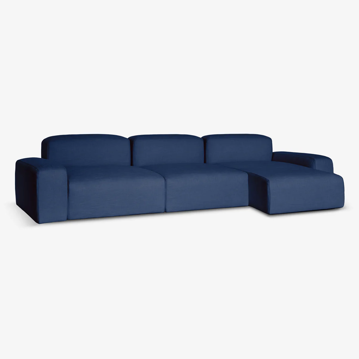 A blue sustainable sofa with a corner chaise, by Biosofa, angle view.