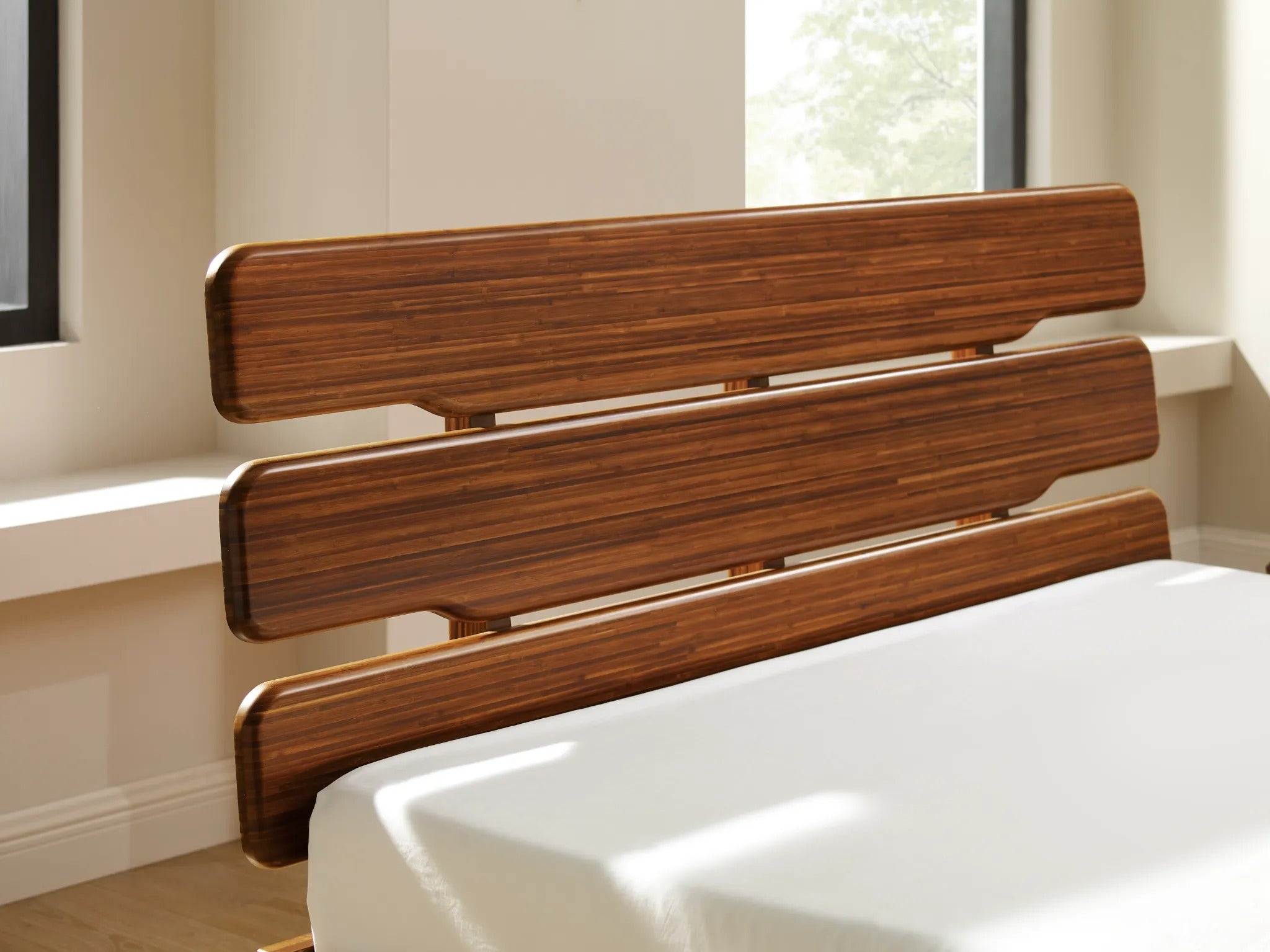 The detail of the headboard of a renewable Currant Bamboo Bedframe by Greenington, in amber color.