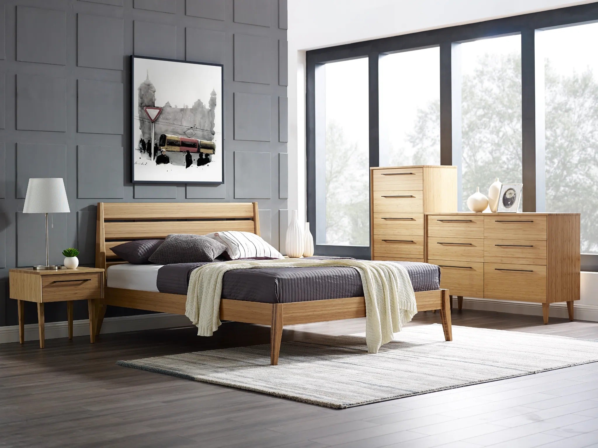 A renewable Sienna Bamboo High Dresser by Greenington, placed in a bedroom alongside a bed, a nightstand, and a low dresser.