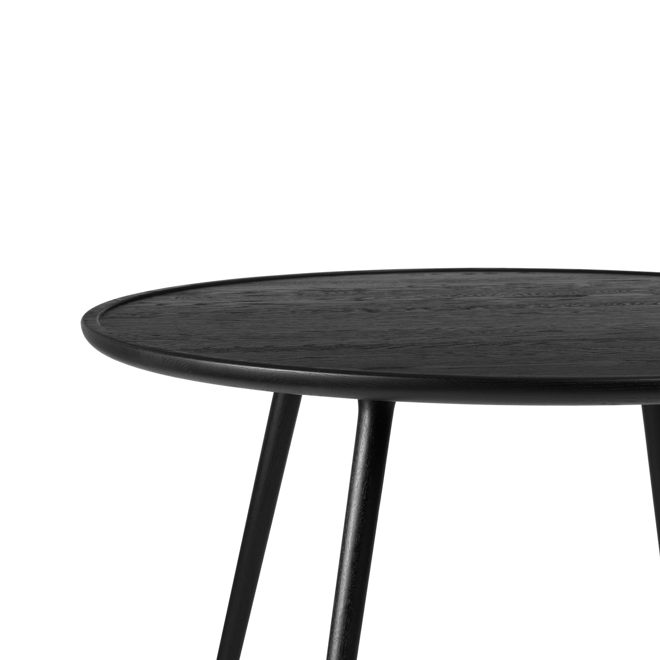 An eco-friendly black Accent dining table made of FSC-certified wood by Mater, side detail view.