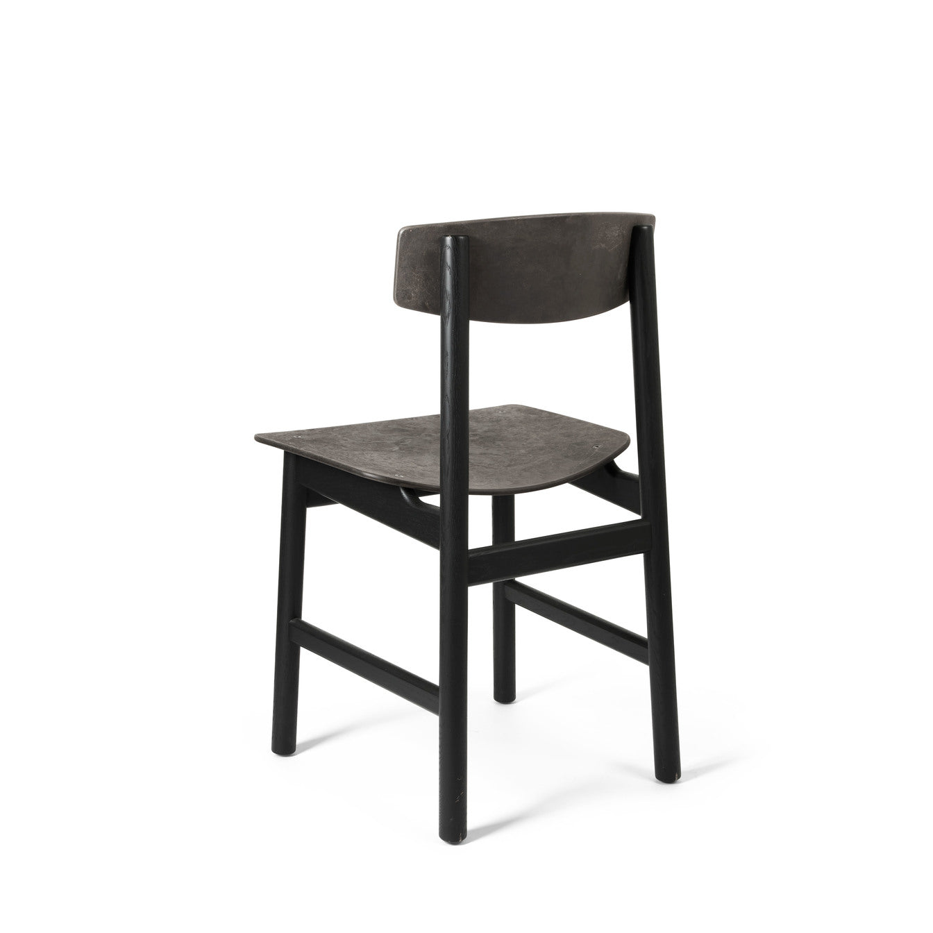 A black Conscious chair made with recycled material by Mater, back view.