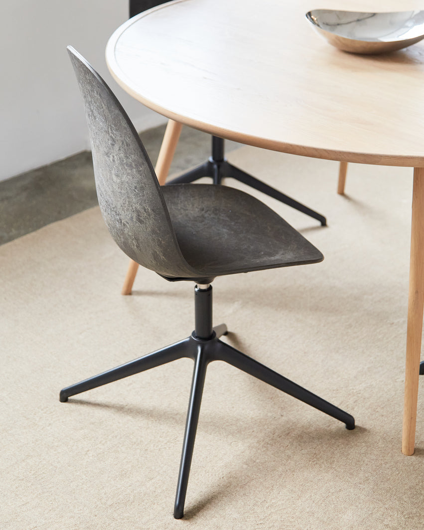 A Matek Eternity Swivel Chair made of recycled materials by Mater, in black, detailed view.