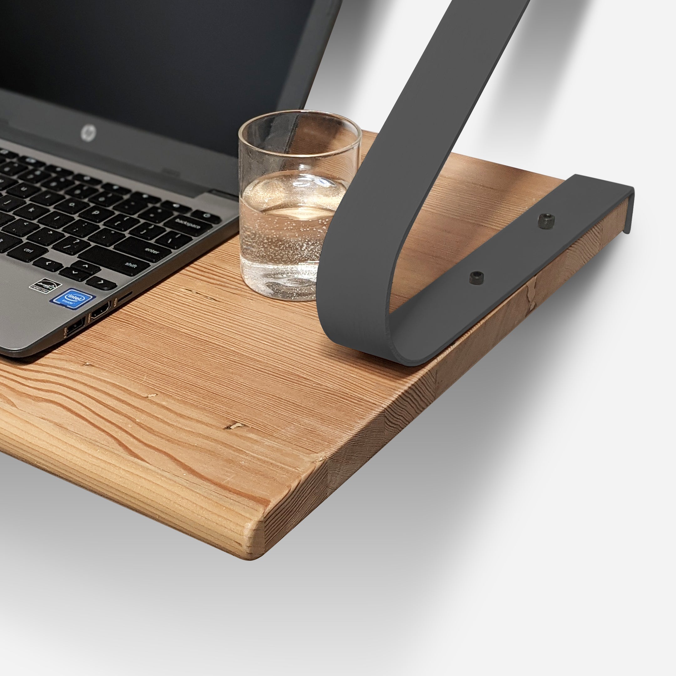 A renewable UnderSTUDY Shelf Desk by Formr, in a wood finish, detailed view.
