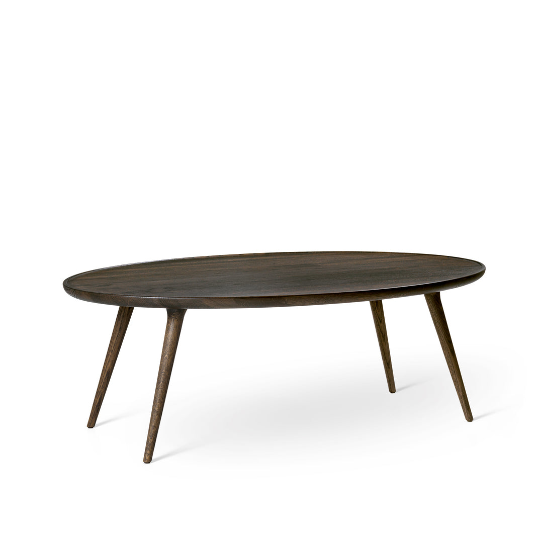 An Accent Oval Lounge Table, Sustainable Oak, made of FSC-certified wood by Mater, in sirka grey.
