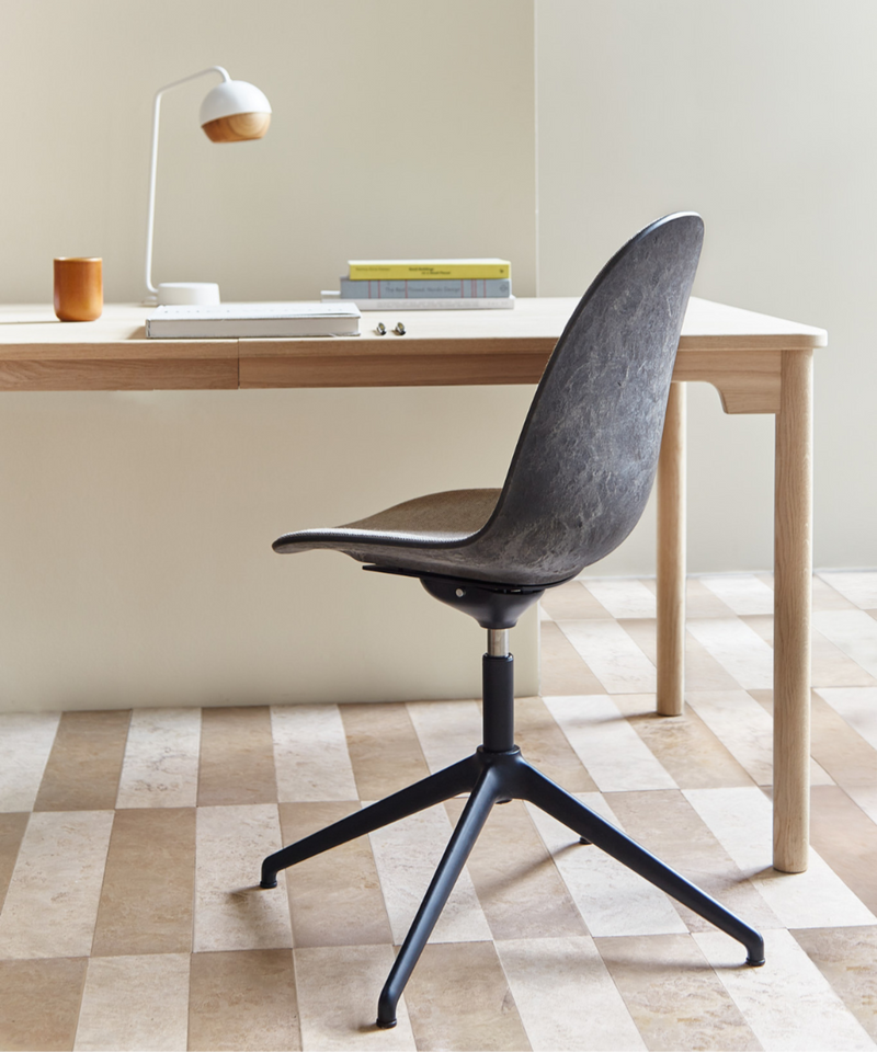 A Matek Eternity Swivel Chair made of recycled materials by Mater, in black, back view.