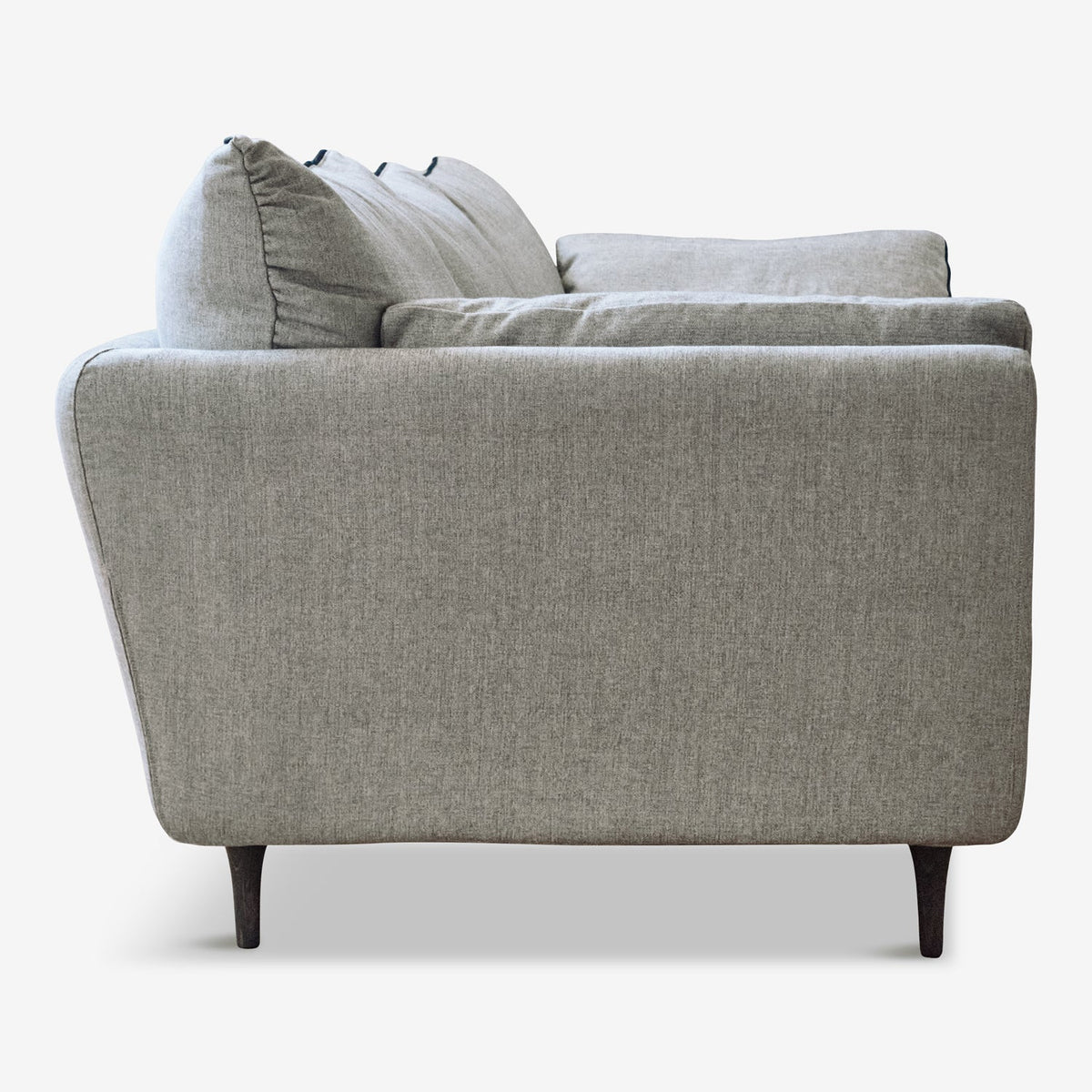 A sustainable Casquet Classic Sofa, made of FSC-certified wood and latex cushions in grey, side view.