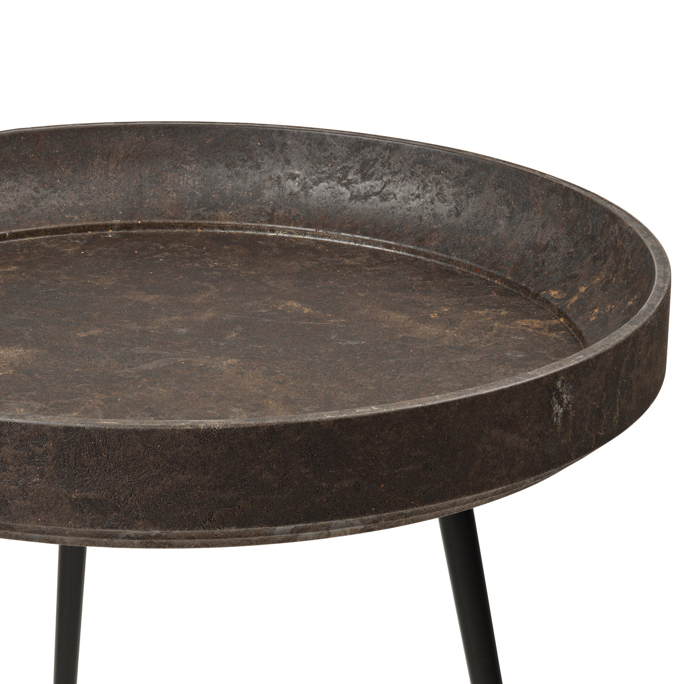 A detail view of the black Matek bowl table made with with upcycled coffee waste, by Mater.