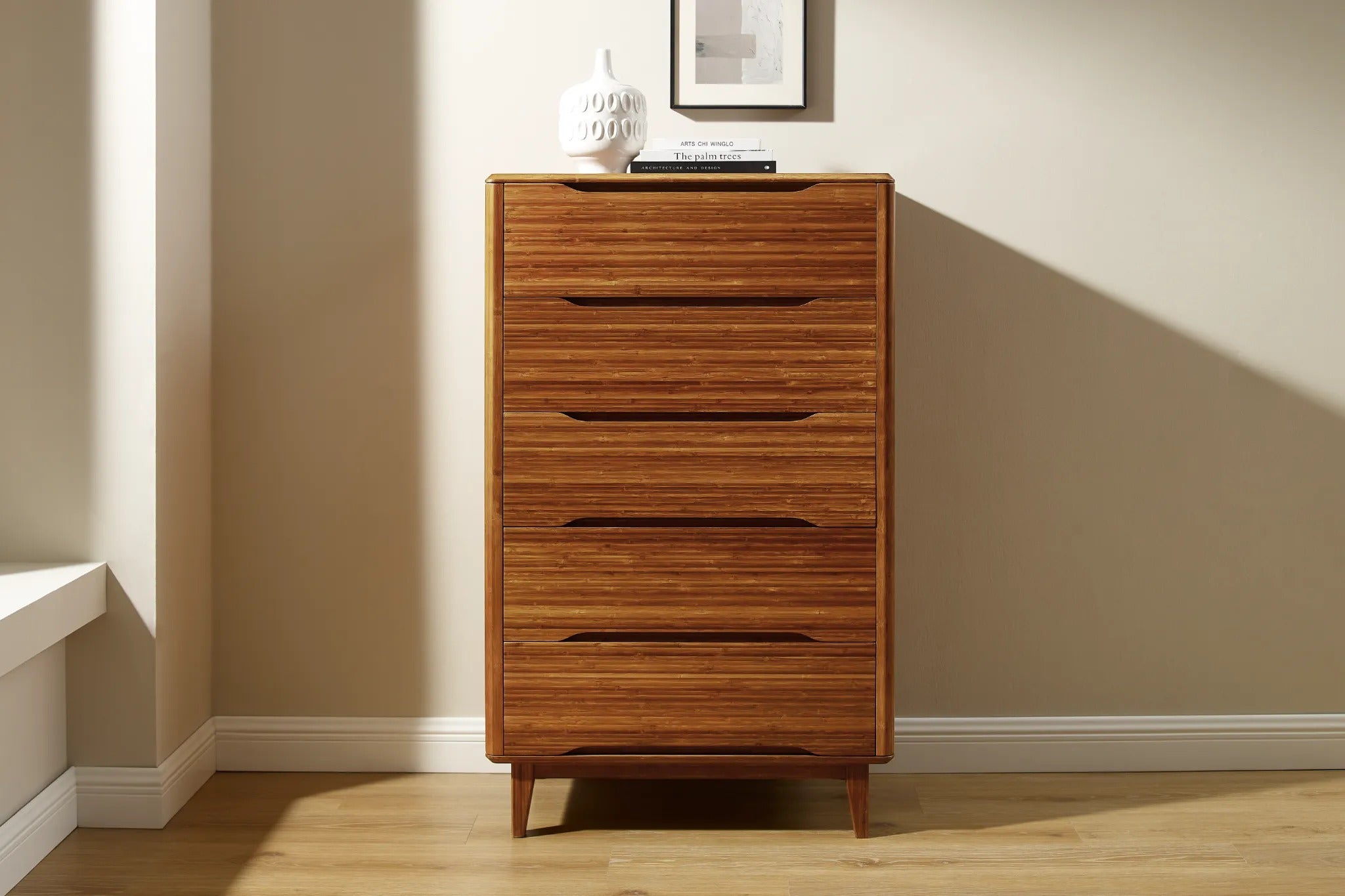 A renewable Currant Bamboo High Dresser by Greenington, in amber color, placed in a living room.