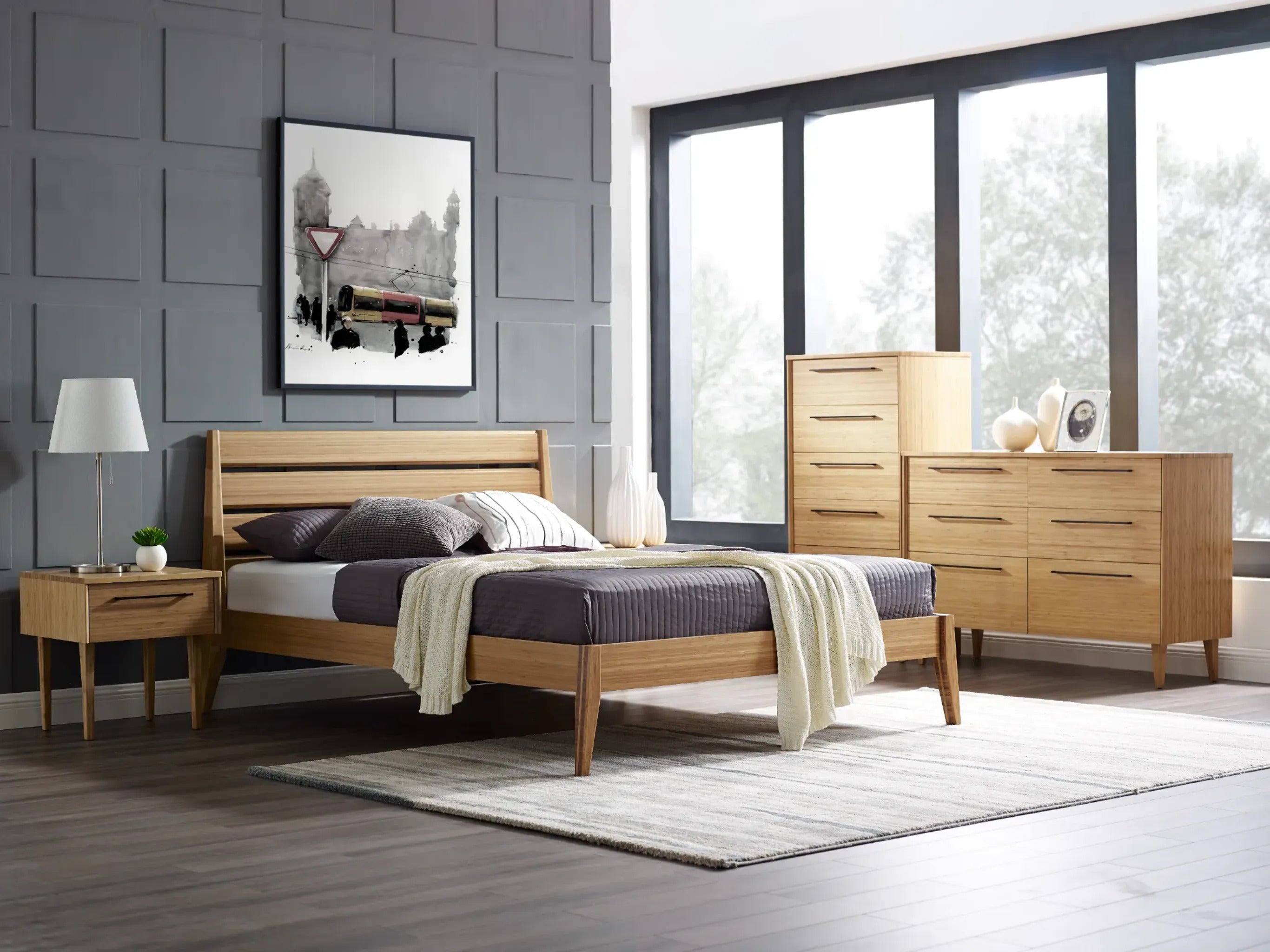 The eco-friendly Sienna Bamboo Bedframe by Greenington, placed in a bedroom with a high dresser, a low dresser, and a nightstand.