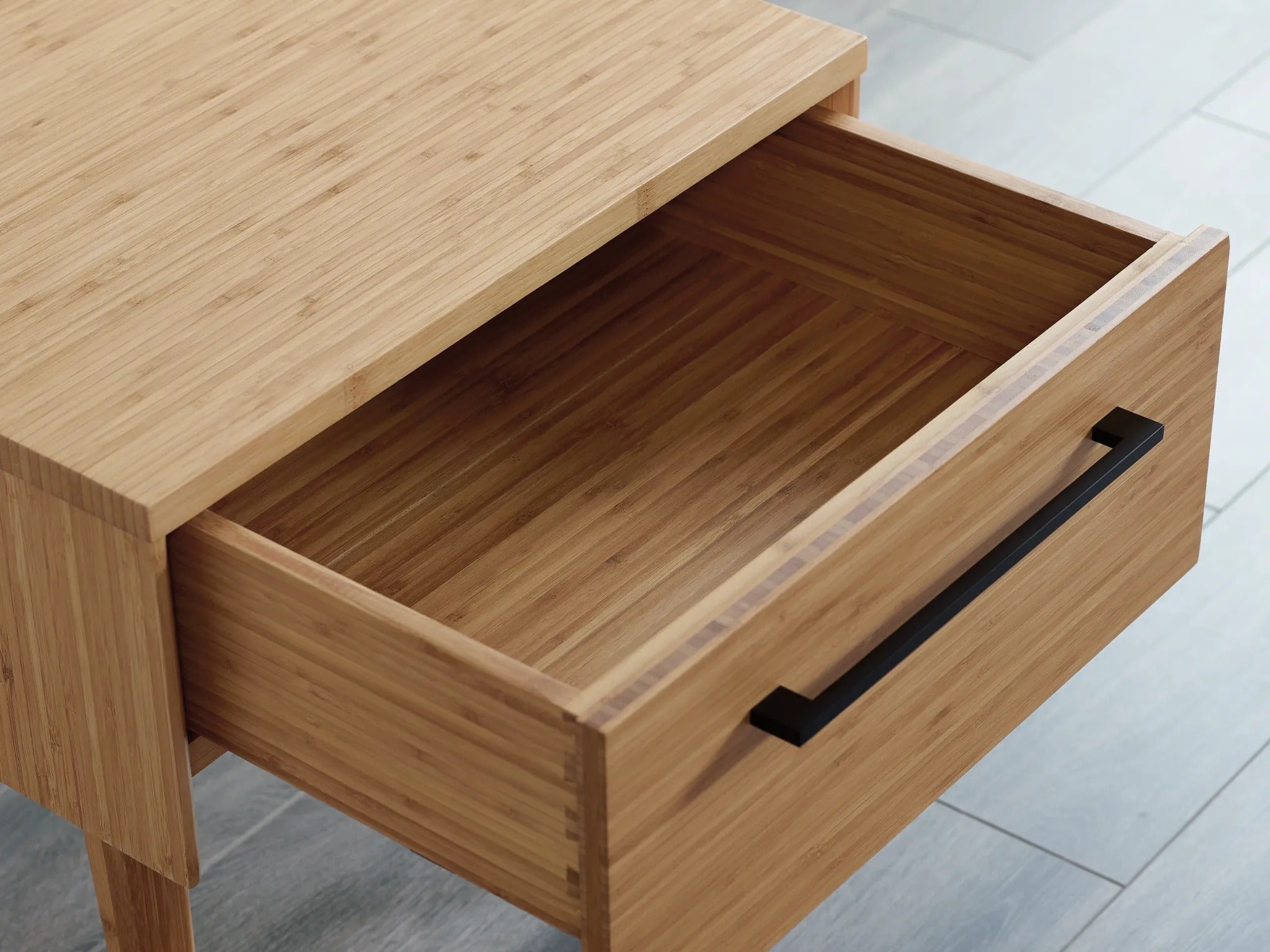 The drawer of the eco-friendly Sienna Bamboo Nightstand by Greenington.
