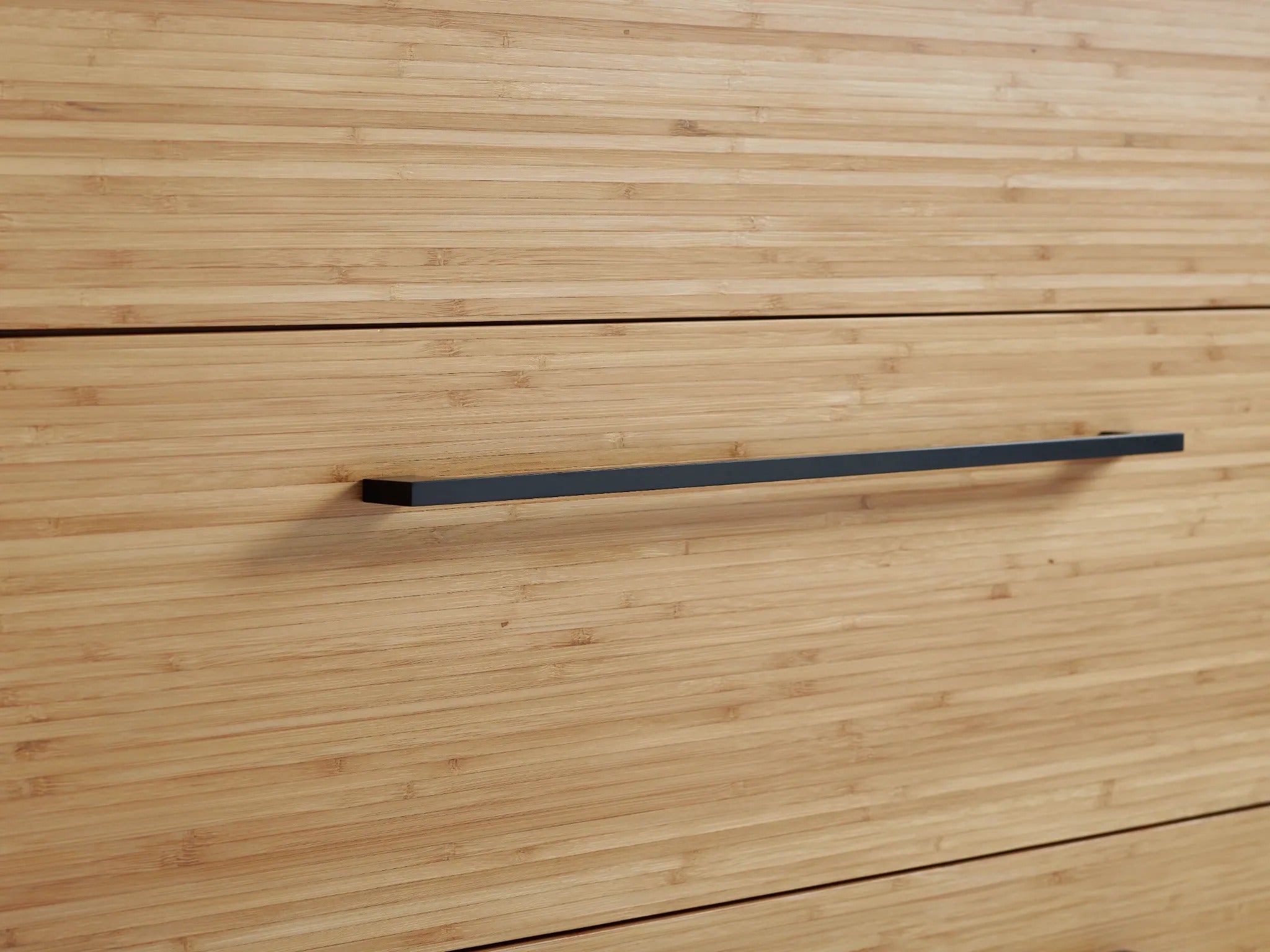 The handle of the drawer of the sustainable Sienna Bamboo Low Dresser, by Greenington.