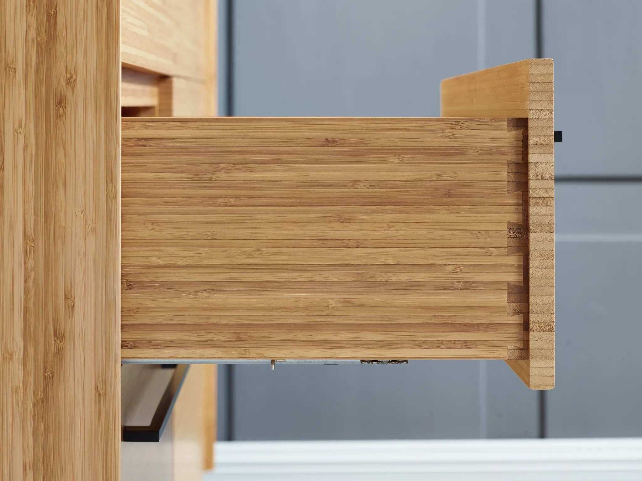 The drawer of the sustainable Sienna Bamboo Low Dresser by Greenington, side view.