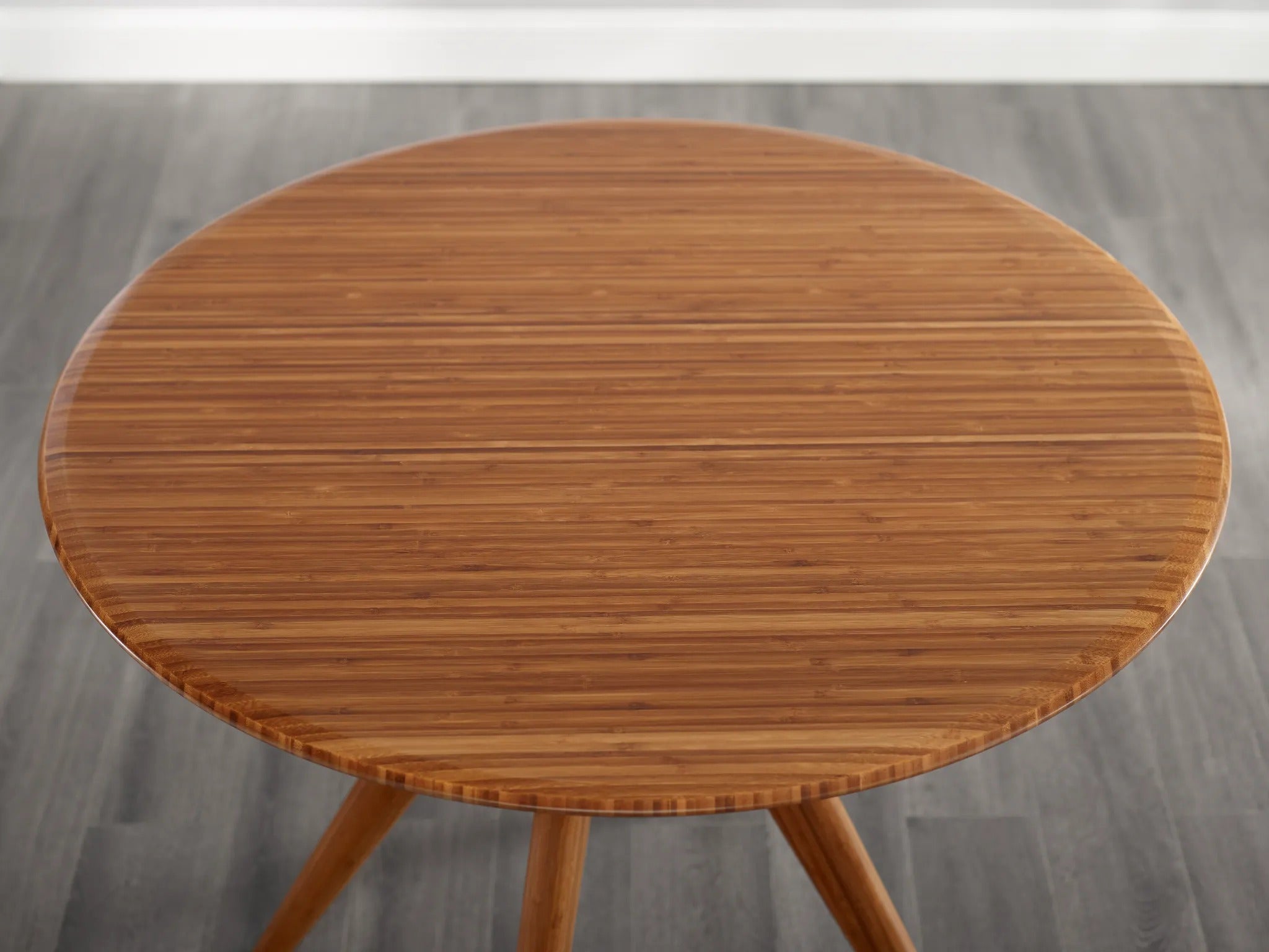 The round surface of the eco-friendly Sitka Bamboo Dining Table, by Greenington.