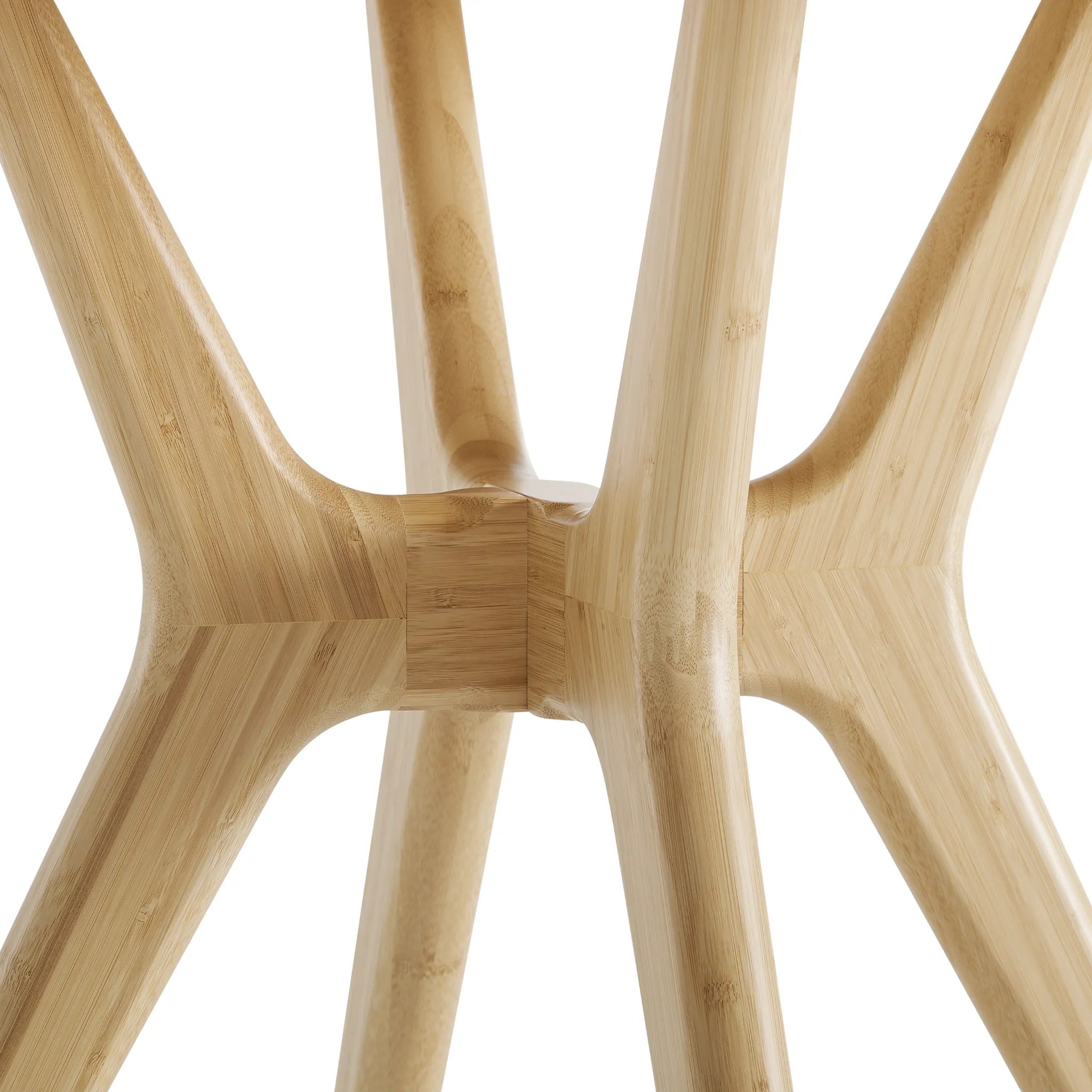 A close-up look at the legs of an eco-friendly Sitka Bamboo Dining Table by Greenington, in wheat color.