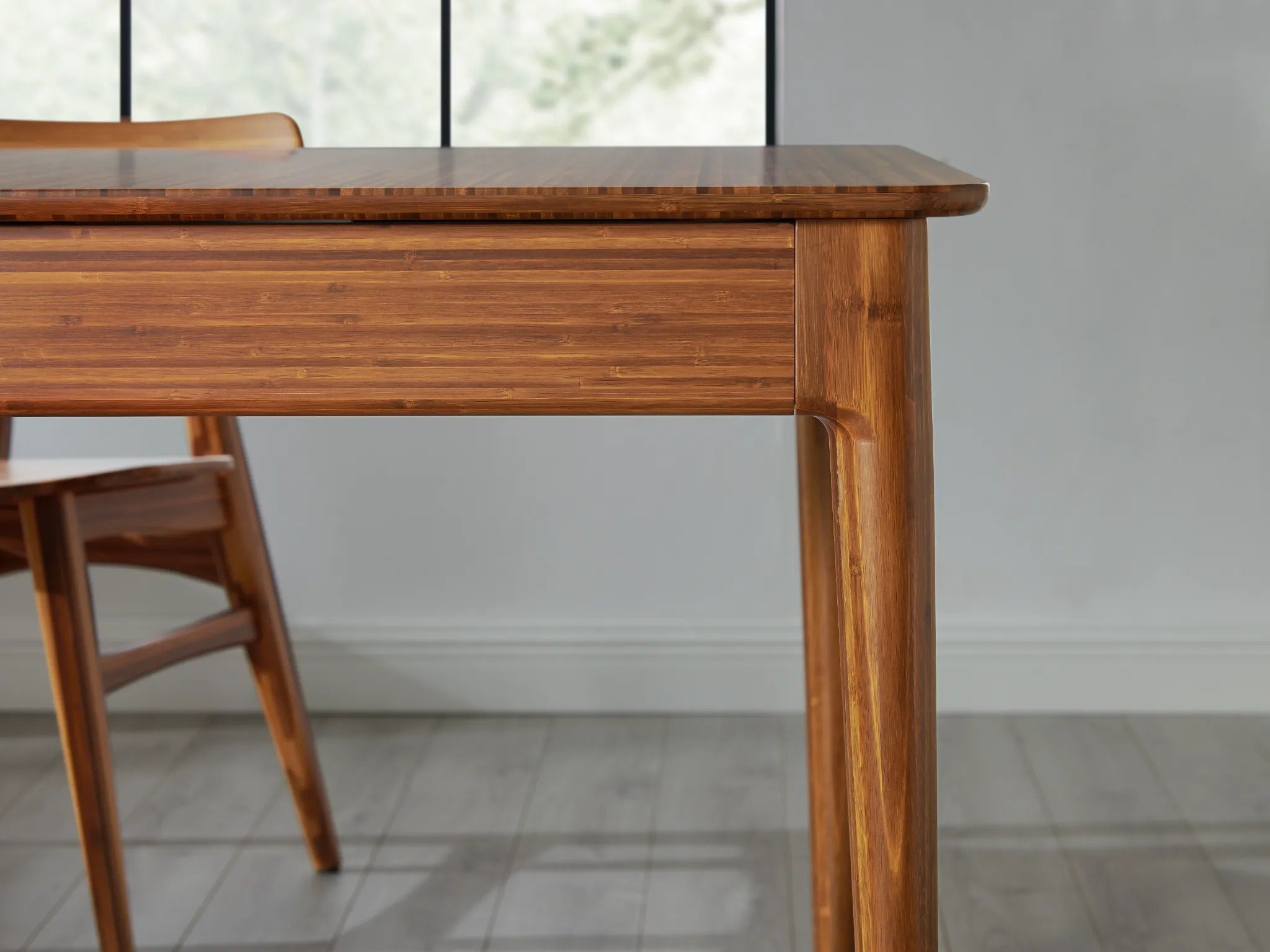 The leg detail of the sustainable Mija Extendable Dining Table, by Greenington.