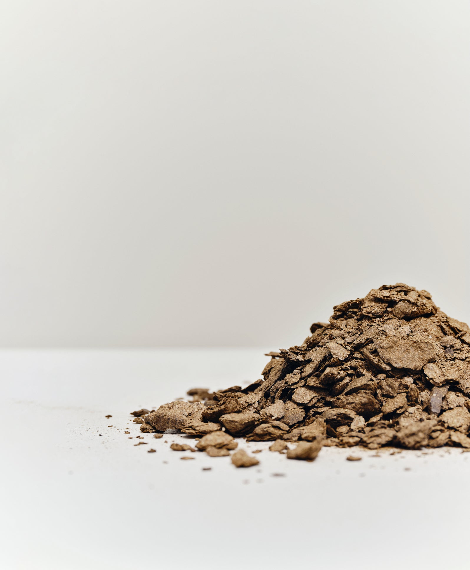 A pile of coffee waste that was used in the Matek eternity chair, by Mater.