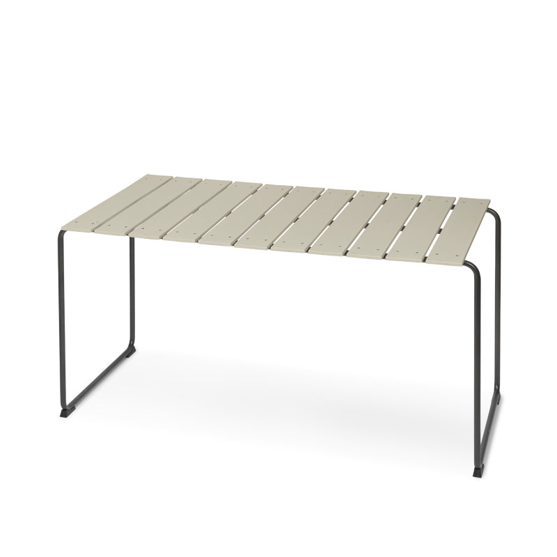 A rectangular Ocean Table made with recycled plastic fishing nets and metal by Mater, in sand color.