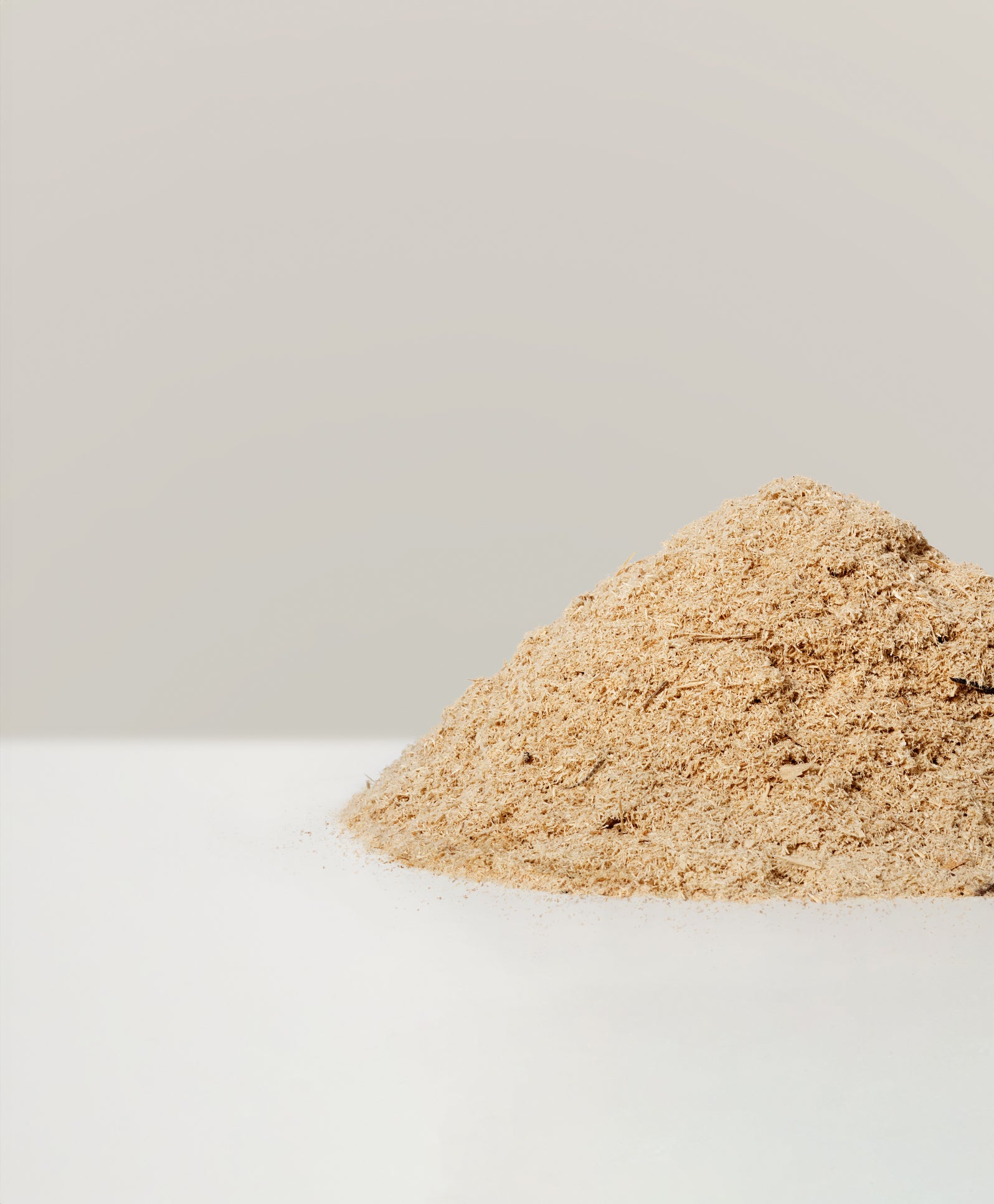 A pile of upcycled fiber-based waste that was used in the Matek eternity chair, by Mater.